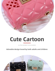 Detail of mini jelly handbag featuring pearl handle, metal chain, and hollow-out side design