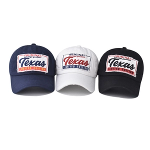 Classic washed cotton Texas embroidered baseball caps in navy, white, and black colors