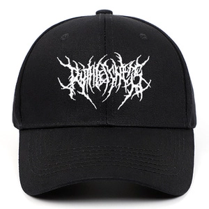 Detail of vintage black cotton baseball cap with distressed texture and white graphic print