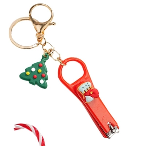 Christmas cartoon keychain with nail clipper featuring a red festive stocking and green tree