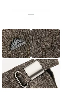 Detail of mountain metal emblem and adjustable silver buckle on brown tweed baseball cap