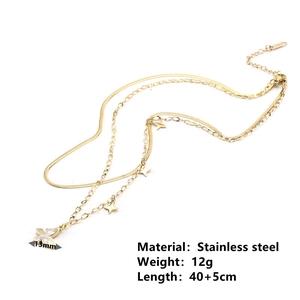 Detail of 13mm butterfly pendant on a gold double-layer stainless steel tassel necklace