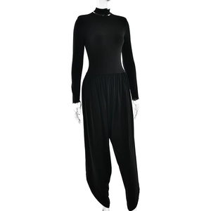 Close-up of black slim fit jumpsuit featuring long sleeves and premium ribbed texture