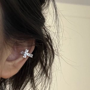 Silver zircon cross ear cuff on ear, minimalist jewelry for daily wear