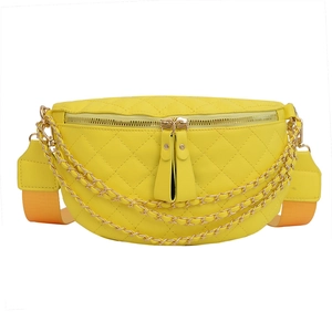 Yellow quilted fanny pack with gold chains and adjustable strap shown on white background