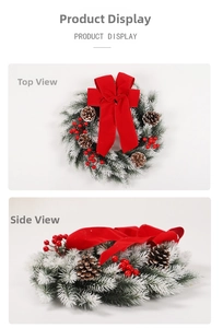 Close-up of Christmas wreath with red bow, pine cones and berries on white backdrop