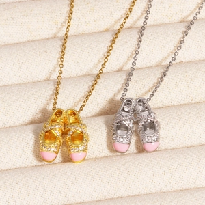 Detail of pink enamel ballet shoe pendants with crystals on gold and silver O-chains