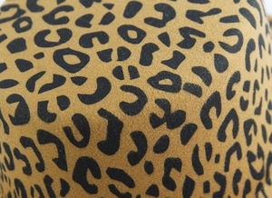 Macro detail of leopard print wool felt fabric with soft texture on a vintage jazz hat