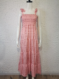 Detail of pink summer maxi dress with red geometric print and tie shoulder straps