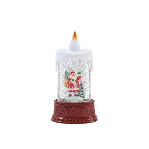 Christmas LED lantern with Santa figure and sparkling water globe on a red base