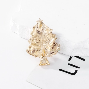 Back view of gold Christmas tree brooch with safety pin and brushed metal finish