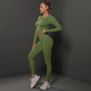 Detail of olive green seamless ruched yoga set featuring thumb holes and high waist fit