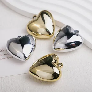 Plated 3D heart charms in gold and silver finish with top rings for jewelry making