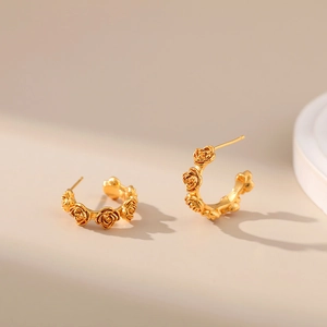 Detail of 18K gold-plated rose flower stud earrings with vintage carved texture design