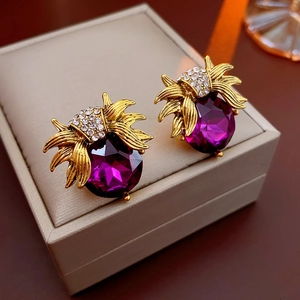Vintage French style gold earrings with purple faceted gemstones and crystal leaves on box