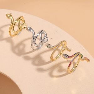 Serpent open rings in gold and silver finishes with cubic zirconia pavé settings