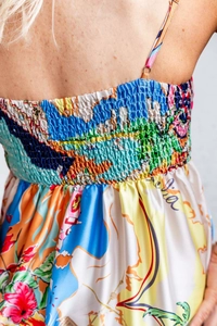 Detail of bohemian floral print dress with smocked back and Italia map pattern