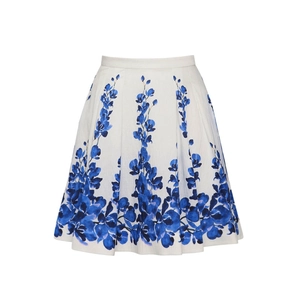 Detail of floral A-line beach skirt featuring blue orchid prints and pleated waist design