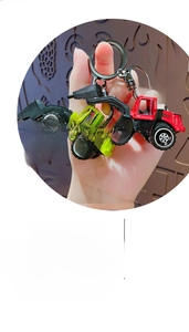 Detail view of colorful alloy construction vehicle keychains with sturdy metal rings
