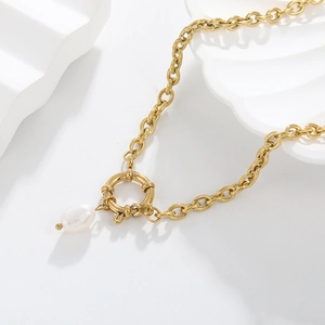 Close-up of 18K gold plated chain necklace featuring a spring clasp and pearl pendant