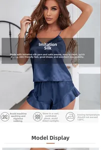 Navy blue silk-satin camisole set with ruffle hem shorts and smooth fabric texture