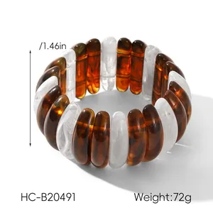 Detailed view of 3.73cm wide amber resin cuff bracelet with marble texture and size label