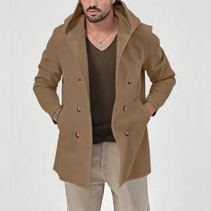 Close-up of double-breasted closure and side pockets on camel hooded trench coat
