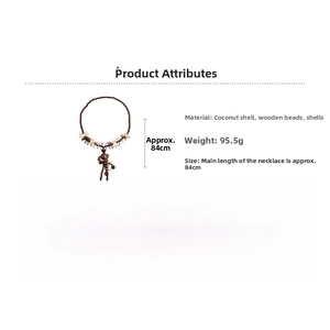 Detail view of ethnic wood bead necklace with coconut shell flower and seashell fringe