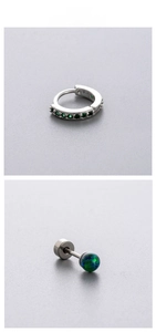 Detailed macro view of titanium steel hoop and opal screw stud earrings set