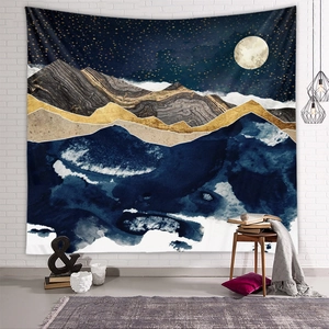 Detailed view of an abstract mountain tapestry with golden peaks on a white brick wall