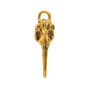 Detailed view of an antique gold bird skull pendant with realistic metal textures