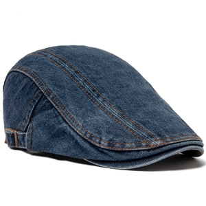 Classic dark blue denim flat cap with adjustable bronze buckle and orange stitching