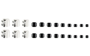 Macro view of 24pcs black and white fake toenails with elegant tulip floral patterns