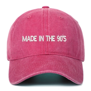 Detailed embroidery of 'MADE IN THE 90'S' on a rose red vintage washed baseball cap