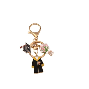 Student graduation keychain with doctor hat and diploma charms in gold enamel finish
