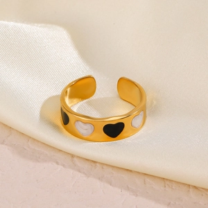 Gold plated stainless steel open heart ring with black and white enamel pattern