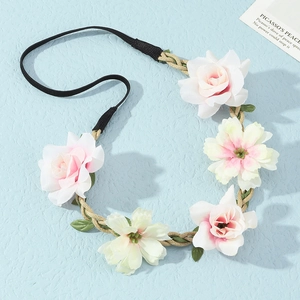 Close-up of handmade floral headband with pink and white roses on a braided rope base