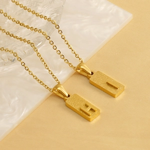Gold stainless steel square letter necklace with sandblasted H and I alphabet pendants