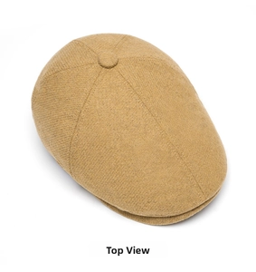 Top view showing the classic ginger herringbone texture and fabric button of the wool cap