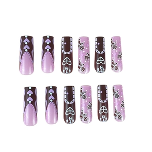 Brown and purple French press-on nails with gingerbread man and heart patterns