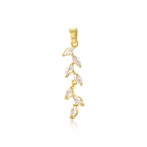 Macro detail of 18k gold plated wheat leaf pendant with sparkling marquise zircon stones