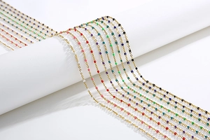 Close-up of colorful enamel beads on a gold-plated necklace chain for masks or glasses