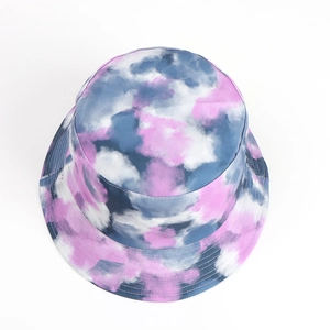 Detail of pink and grey tie-dye reversible bucket hat with cotton fabric texture