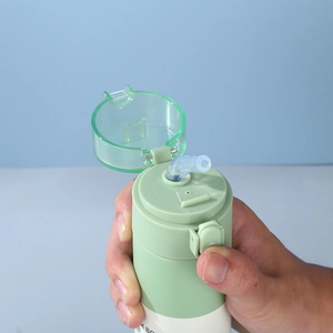 Mint green stainless steel mini straw cup with flip-top lid and portable design