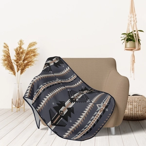 Close-up of geometric bohemian pattern flannel blanket draped on a cozy armchair