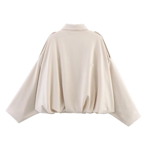 Detailed back view of a beige oversized bomber jacket with smooth matte suede-like texture