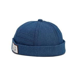 Navy blue denim docker hat with New World patch showing vintage stitch detail