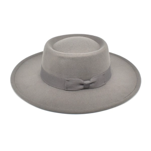 Classic grey wool boater hat with matching ribbon and small bow on white background