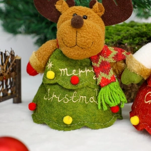 Close-up of reindeer plush candy bag with green Christmas tree skirt and embroidery