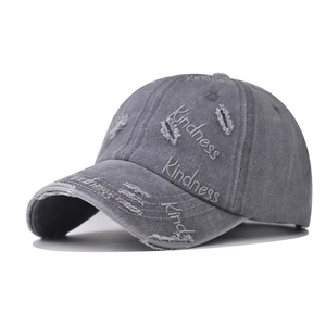Distressed grey baseball cap with Kindness embroidery and vintage washed torn details